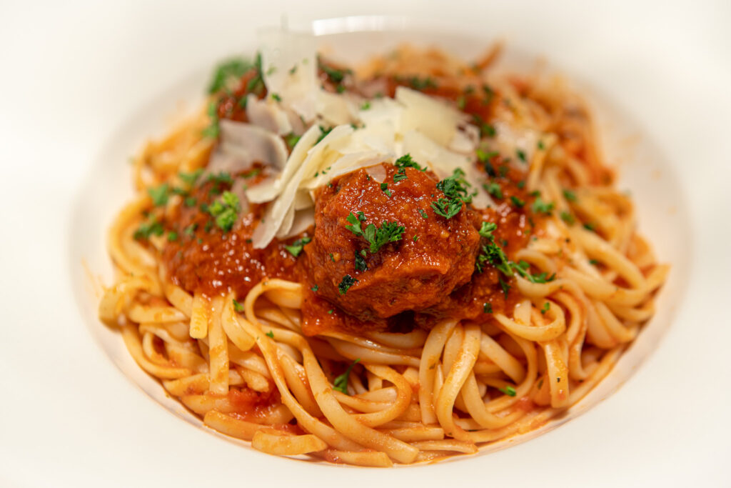 Paulie’s Fine Italian signature dishes Spaghetti and Meatballs, Lasagna, Chicken Piccata, Garlic Bread with Cheese
